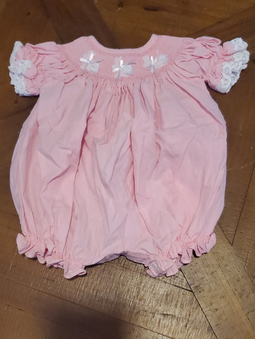 Pink Smocked Baby One-Piece Bodysuit with Lace Trim